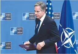  ?? (Saul Loeb/Reuters) ?? US SECRETARY OF STATE Antony Blinken leaves after a news conference at a NATO Foreign Ministers meeting in Brussels, in November. If Israel were a NATO member, the US would have been required to actively join any counterstr­ike against Iran, the writer asserts.