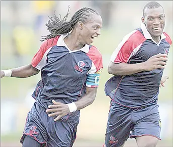  ?? (Courtesy pic) ?? Back in the day...Mfanafuthi ‘Taribo’ Bhembe (L) celebratin­g a goal with the then young Sabelo ‘Sikhali’ Ndzinisa in this undated picture.