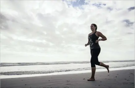  ??  ?? Claire McFarlane sets out to conquer another beach in her Beach Run for Awareness campaign (Project Bra). She plans to run 16km on 184 beaches.