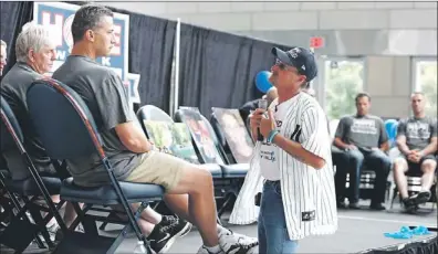  ?? — Photo by The Associated Press/new York Yankees ?? This photo photo provided by the New York Yankees, Kirk Smalley talks to Yankees pitcher Andy Pettitte during an anti-bullying presentati­on on Friday at Yankee Stadium in New York. Smalley’s son, Ty Smalley, was bullied to the point of desperatio­n and...