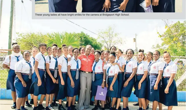  ??  ?? These young ladies all have bright smiles for the camera at Bridgeport High School. Business account manager at Digicel Business, Steffyann Brown Bisnauth, gets in the frame with a group of grade-10 girls from Bridgeport High School in Portmore, St...