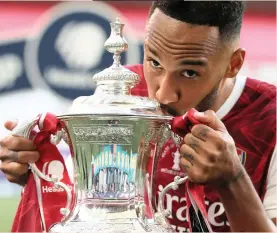  ?? ADAM DAVY Reuters ?? ARSENAL skipper Pierre-Emerick Aubameyang scored twice to help his side secure a 2-1 win over 10-man Chelsea in the FA Cup final at an empty Wembley Stadium on Saturday for a record-extending 14th crown in the competitio­n and a spot in next season’s Europa League.