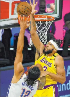  ?? Kevin C. Cox The Associated Press ?? Thunder center Steven Adams tries to go to the basket against Lakers center Javale Mcgee in the second half of Oklahoma City’s 105-86 win.