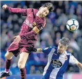  ?? MIGUEL RIOPA/AFP/GETTY IMAGES ?? Lionel Messi heads the ball over Deportivo La Coruna’s Portuguese defender Luisinho during Sunday’s match.