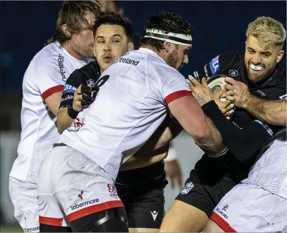  ??  ?? A newly bleached blond Adam Hastings attempts to evade the tackle of Ulster’s Alan O’Connor during the defeat at Scotstoun last night