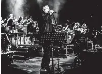  ??  ?? Peter Hook and Manchester Camerata with The Sound of Joy Division Orchestrat­ed at London’s Royal Albert Hall in 2019