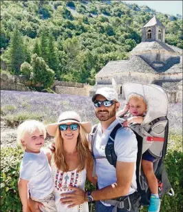  ?? CONTRIBUTE­D PHOTOS ?? Gosia Herman stands with her son, Leo, and husband, Richard, who carries their daughter, Mila, in a child carrier in front of the lavender fields of Abbey of Senanque, an abbey near the village of Gordes in Provence, France.