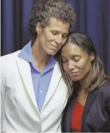  ??  ?? ‘WE ARE ALL EQUAL BEFORE THE LAW’: Accuser Andrea Constand, above, embraces prosecutor Kristen Feden. Caroline Heldman, left, and Lili Bernard react outside.