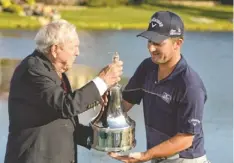  ?? JOHN DAVID MERCER, USA TODAY SPORTS ?? Matt Every receives the trophy from tournament host Arnold Palmer on Sunday after claiming his first PGA Tour victory.