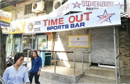  ?? SUNSTAR FOTO / ARNI ACLAO ?? SHUTDOWN. A closure order was posted by Cebu City Hall personnel on the door of Time Out Sports Bar on F. Ramos St., as Mayor Tomas Osmeña continues to run after establishm­ents operating without business permits.