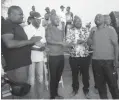  ??  ?? From left: Mqondisi Sibanda, Ronald Sibanda, an unidentifi­ed man (centre), Bhekimpilo Sithole and Butho Dube thanking villagers for attending the tournament