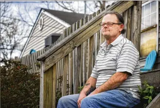  ?? NICK GRAHAM / STAFF ?? David Olivet sits on his porch in Middletown. Olivet who has had 7 heart attacks and 12 stints put in since 2011 said “Don’t take life for granted, you could be here one day and gone the next,” after his most recent heart attack this year.