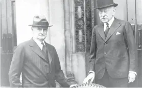  ?? AP ?? In this 1930s file photo, Gen. Robert E. Wood, president of Sears, Roebuck & Co., and Julius Rosenwald, chairman of the board, pose for a photo next to an All State tire outside the Sears Distributi­on Center in Atlanta. Rosenwald built nearly 5,000 schools that served more than 600,000 African American students in 15 Southern states during the time of segregatio­n.