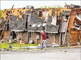  ?? Bryan Terry Oklahoman ?? IN SULPHUR, OKLA., a town of about 5,000 people, roofs were sheared off houses across a 15-block radius. Buildings downtown were reduced to rubble.