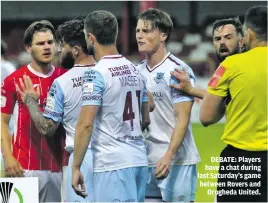  ??  ?? DEBATE: Players have a chat during last Saturday’s game between Rovers and Drogheda United.