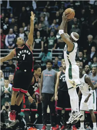  ?? DYLAN BUELL/GETTY IMAGES ?? Toronto Raptors guard Kyle Lowry, seen defending Milwaukee Bucks guard Jason Terry during the first round of the NBA playoffs last month in Milwaukee, has little to say about his team’s inflated assist ratio in the post-season. “We made a lot of...