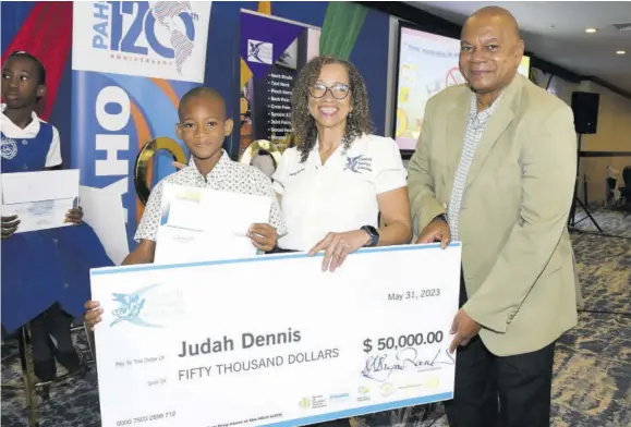  ?? (Photos: Joseph Wellington) ?? St Richard’s Primary School student Judah Dennis (left), who is the winner of the poster competitio­n done to highlight the harmful use of tobacco, shares a photo op with executive director at Physical Therapy Solutions Dr Bernadette Bryan Frankson (centre) and executive director at National Council on Drug Abuse Michael Tucker, on Wednesday.