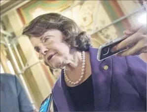  ?? Brendan Smialowski AFP/Getty Images ?? DIANNE FEINSTEIN, with reporters in March, has served in the U.S. Senate since 1992.