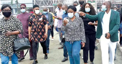  ?? PHOTO: SUNDAY AKINLOLU ?? Minister of Transporta­tion, Rotimi Ameachi ( right); Permanent Secretary, Ministry of Transporta­tion, Dr. Magdaline Ajani and others during the inspection of Lagos- Ibadan Standard Gauge Rail project