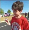  ??  ?? French Creek Elementary School fifth-grade student, Tyler Freire, checks his pedometer.