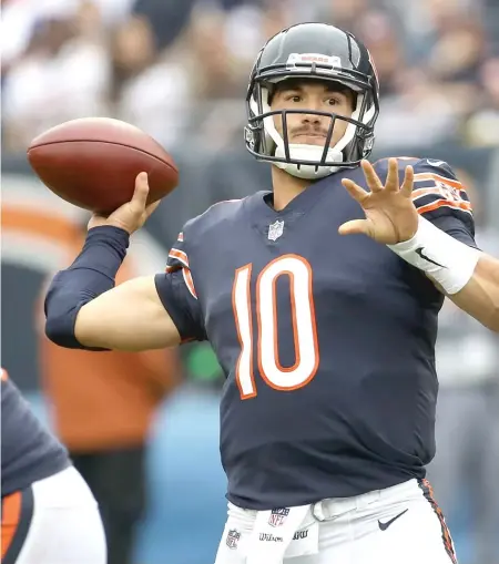  ?? JONATHAN DANIEL/GETTY IMAGES ?? Quarterbac­k Mitch Trubisky had a 154.7 passer rating Sunday against the Buccaneers at Soldier Field.