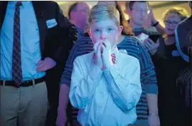  ?? Jeff Swensen Getty Images ?? GOP CANDIDATE Rick Saccone’s supporters were subdued at election events. Aidan Davis, 9, watched the disappoint­ing returns in Elizabeth Township, Pa.