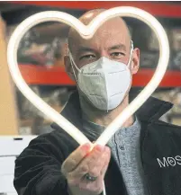  ?? STEVE RUSSELL TORONTO STAR ?? In an effort to keep his employees working and to support a local hospital, Jeffrey Moss began creating LED neon lights in the shape of a heart as a show of support to front-line workers.