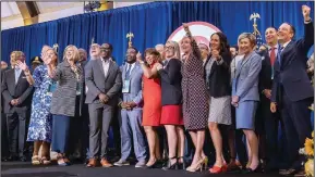  ?? (AP/Milwaukee Journal-Sentinel/Jovanny Hernandez) ?? The Milwaukee Hosting Committee celebrates Friday at the JW Marriott in Chicago after the signing of the official document selecting Milwaukee to host the 2024 Republican National Convention.