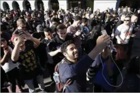  ?? MARCIO JOSE SANCHEZ — THE ASSOCIATED PRESS FILE ?? “Pokemon Go” players begin a group walk along the Embarcader­o in San Francisco in July 20. “Pokemon Go” was an instant hit when it debuted in July, as millions of people discovered augmented reality and joined stampedes from Central Park to Sydney...