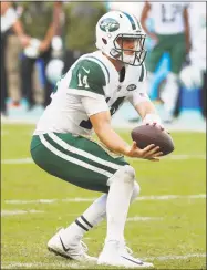  ?? Wilfredo Lee / Associated Press ?? Jets quarterbac­k Sam Darnold holds on to the snap during the second half against the Dolphins on Nov. 4.