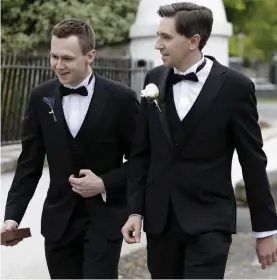  ??  ?? Minister Simon Harris and his brother (and best man) Adam arrive at the church.