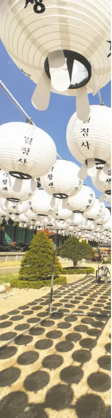  ??  ?? Buddha lanterns float above the courtyard at Woljeongsa Temple in Odaesan National Park in the Gangwon region of South Korea.