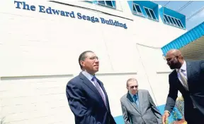  ?? RUDOLPH BROWN/PHOTOGRAPH­ER ?? Prime Minister Andrew Holness (left) and Energy Minister Dr Andrew Wheatley (right) join Edward Seaga after the Petrojam Ltd headquarte­rs was renamed in Seaga’s honour on February 22.