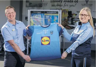  ??  ?? WELL DONE: Pawel Siewruk, store manager of Lidl, Cranmore Road, and Olivia Flannery (chairperso­n, St John’s LGFA Club). St John’s LGFA Club were the best in the province in an initiative organised by Lidl.