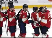  ?? MARTA LAVANDIER — THE ASSOCIATED PRESS ?? Florida Panthers goaltender Sergei Bobrovsky (72) is congratula­ted by teammates after a 3-1 win over Toronto.