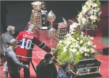  ?? REUTERS ?? Fans pay their respects during the visitation for late Montreal Canadiens ice hockey player Guy Lafleur at the Bell Centre in Montreal on Sunday.