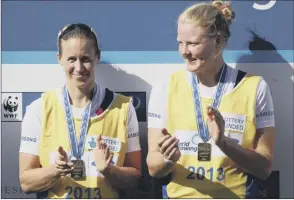  ??  ?? Swann, left, and Glover are all smiles after receiving their gold medals