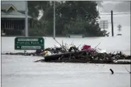  ?? ?? Debris sits in the middle of the flooded Windsor Bridge on the outskirts of Sydney July 4.