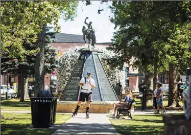  ?? (AP/Jackson Hole News & Guide/Ryan Dorgan) ?? Dusty Campbell begins his 285-mile rollerblad­e trek to Salt Lake City on July 2 in front of the veterans monument on the Town Square in Jackson, Wyo. Campbell’s 47-hour trek was a way to raise money for the Wounded Warrior Project.