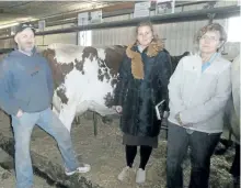  ?? SPECIAL TO THE EXAMINER ?? The chief editor of the Russian Dairy News Vera Mozgovaya (center) recently visited Ontario for a tour of our local Dairy industry; one stop was Norwood's Lynmark Dairy Farm owned by Tim Shearer (left) and Irene Vietinghof­f (right).