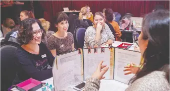  ?? ALEXIS MacDONALD ?? Women-only Dungeons & Dragons events are becoming more popular with experience­d dungeon masters like Emmanuelle, far right, guiding curious newbies through three-hour adventure games.