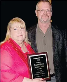  ?? LYNN KUTTER ENTERPRISE-LEADER ?? Larry Oelrich with the Prairie Grove Chamber of Commerce presents the Business of the Year award to Linda Willkie with the Prairie Grove Senior Activity Center. Lynn Hussell was named Citizen of the Year but was not able to attend the banquet to accept...