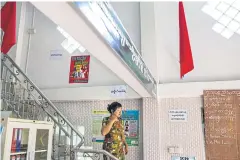  ??  ?? BELOW
Ohnmar Myint, a union member since its founding, at the offices of the Federation of Garment Workers Myanmar. “I worry for the future of garment workers here without representa­tives,” she says.