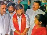  ?? — DC ?? TPCC chief A. Revanth Reddy speaks to a family member of one of the victims of the drain tragedy in Hyderabad on Saturday.