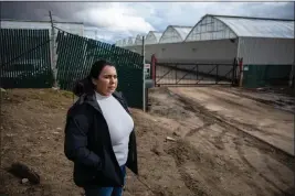  ?? MARTIN DO NASCIMENTO - CALMATTERS ?? Michelle Hackett stands at the entrance to Riverview Farms in Salinas that flooded in the mid-march storms.
