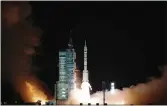  ?? LI GANG — XINHUA VIA AP ?? The crewed spaceship Shenzhou-13, atop a Long March2F carrier rocket, is launched from the Jiuquan Satellite Launch Center in northwest China’s Gobi Desert, Friday.