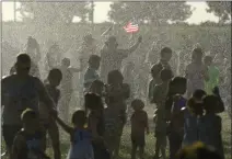  ?? RECORDER PHOTO BY CHIEKO HARA ?? The water spray zone was popular with all ages Saturday during Freedom Fest.