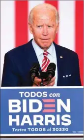  ??  ?? Democratic presidenti­al candidate Joe Biden plays music from his cell phone as he participat­es in a Hispanic Heritage Month event at the Osceola Heritage Park in Kissimmee, Florida.