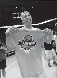  ?? AP/CRYSTAL LOGUIDICE ?? Tennessee forward Grant Williams (2) holds an SEC champions T-shirt after the Volunteers defeated Georgia 66-61 on Saturday in Knoxville, Tenn., to win a share of the conference title with Auburn.