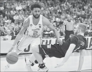  ?? Associated Press ?? Driving: North Carolina guard Joel Berry II (2) moves past Butler guard Tyler Lewis in the first half of a South Regional semifinal game of the NCAA men's college basketball tournament on Friday in Memphis, Tenn.